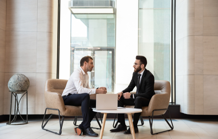 A discount broker talking to a client
